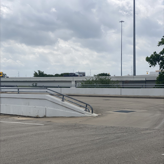 Down rail next to a parking lot