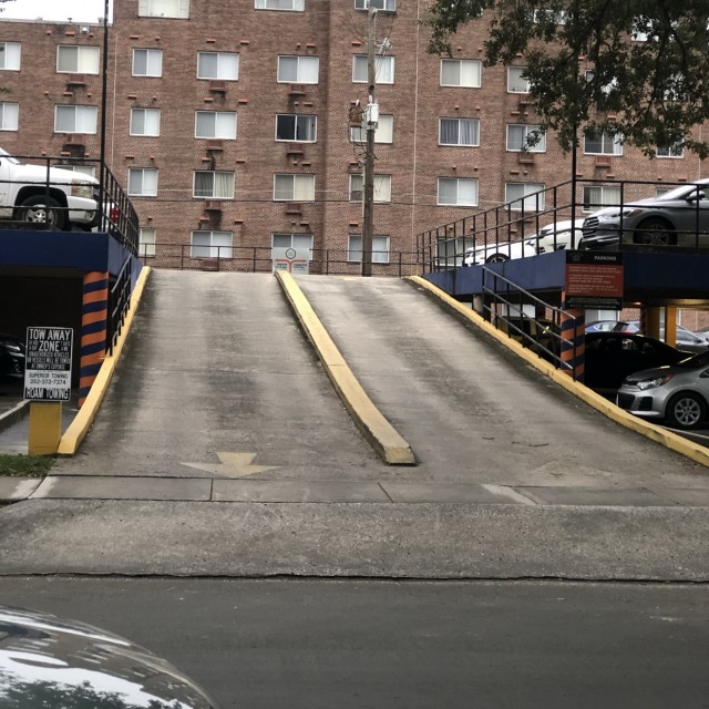 Downhill curb at parking garage 