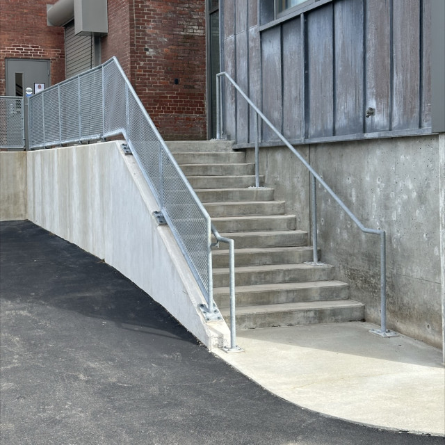 Grated drop rail