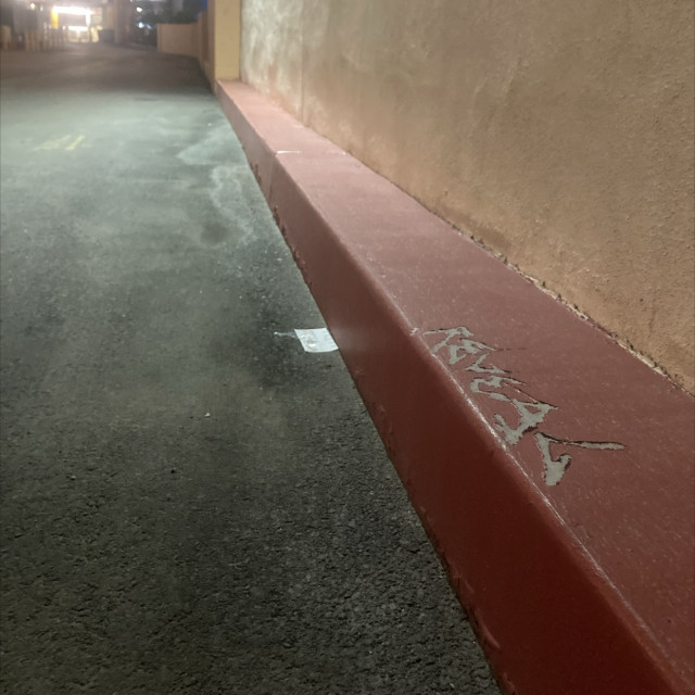 Insanely long red curb