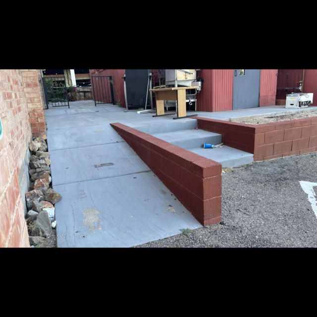 Down ramp with flat ledge on the side with a 3 stair on the other side of the ledge.