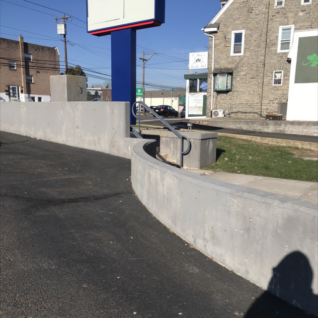 ledge and stairs behind (skate stops on railing behind)